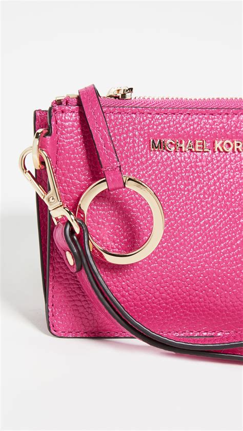 michael kors small pink purse.